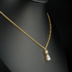A luxurious gold-plated 925 sterling silver chain necklace featuring a sparkling pear-shaped Ice Cut gemstone pendant.