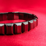 An authentic natural metallic gunmetal hematite gemstone rolex link style stretch bracelet.