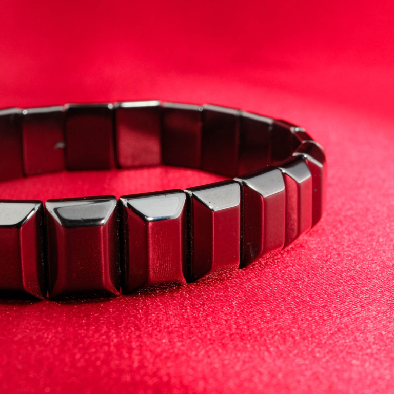 An authentic natural metallic gunmetal hematite gemstone rolex link style stretch bracelet.