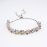 An authentic natural multi-color faceted sapphire gemstone 925 sterling silver leaf vine adjustable slider bolo bracelet.