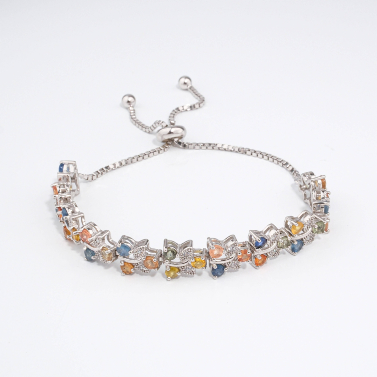 An authentic natural multi-color faceted sapphire gemstone 925 sterling silver leaf vine adjustable slider bolo bracelet.