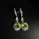 An authentic natural 3.67ct faceted oval green peridot gemstone 925 sterling silver drop halo dangle earrings.