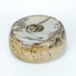 An authentic natural picture jasper gemstone hand-carved jewelry box with lid and bronze shell handle.