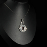 An authentic natural baguette cut red garnet gemstone padlock design engraved 925 sterling silver pendant necklace.