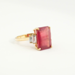 An authentic natural 8.93ct faceted emerald-cut red ruby gemstone 14k gold plated 925 sterling silver baguette ring.
