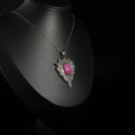 An authentic 16.75ct natural oval cabochon ruby gemstone 925 sterling silver gothic shield pendant necklace.