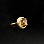 An authentic natural faceted oval smoky quartz and treated yellow moissanite 14k gold plated 925 silver crescent moon ring.