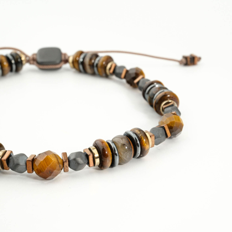 An authentic natural tiger's eye and hematite gemstone macrame braided adjustable miyuki style bracelet.