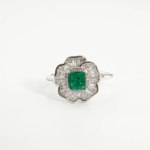 An authentic 0.81ct natural Zambian emerald radiant cut gemstone 925 sterling silver floral halo ring with baguettes.