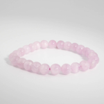 Hochwertiges elastisches Damen Perlenarmband aus echten rosa Kunzit-Kugeln 6-7 mm in A-Qualität.