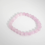 Hochwertiges elastisches Damen Perlenarmband aus echten rosa Kunzit-Kugeln 6-7 mm in A-Qualität.