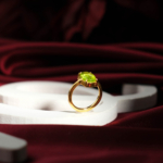 Genuine natural olive green peridot oval faceted gemstone yellow gold plated 925 sterling silver solitaire ring.