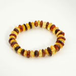 Bracelet élastique pour adulte en véritable ambre multicolore de la Baltique certifié forme disque.