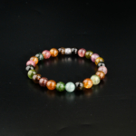 Natural 8mm 7A+ grade multicolor rainbow tourmaline beaded stretch bracelet on mirror reflection and white satin