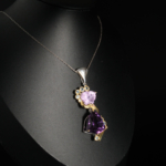 Genuine natural purple trillion faceted amethyst and light blue topaz gemstone pendant 925 sterling silver chain white bust display.