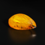 Genuine natural Baltic amber polished rough palm stone with visible fossil inclusions 25.81g.