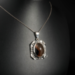 Genuine natural brown banded agate gemstone cabochon vintage 925 sterling silver butterfly accent pendant.