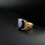 Genuine natural deep blue sapphire oval faceted gemstone yellow gold plated 925 sterling silver solitaire ring.