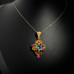 Natural faceted square blue topaz pendant necklace with multicolor sapphire and ruby halo in gold plated 925 silver on white satin.