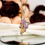 Genuine natural yellow citrine, purple amethyst and pink rubellite tourmaline geometric pendant 925 sterling silver black background.