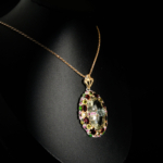 Genuine natural green amethyst prasiolite carved rose pendant with red garnet and peridot halo 925 sterling silver black background.