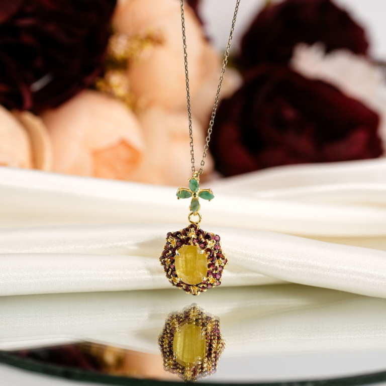Genuine natural yellow sapphire oval gemstone surrounded by garnets with emerald flower bail gold plated 925 sterling silver pendant necklace.